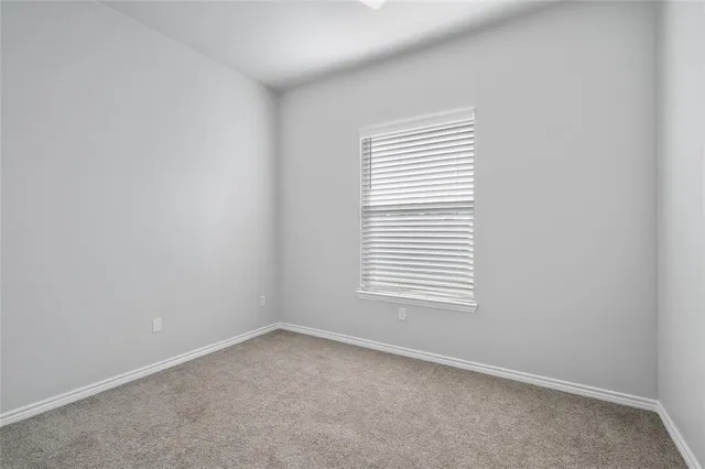a living room with furniture and flowers