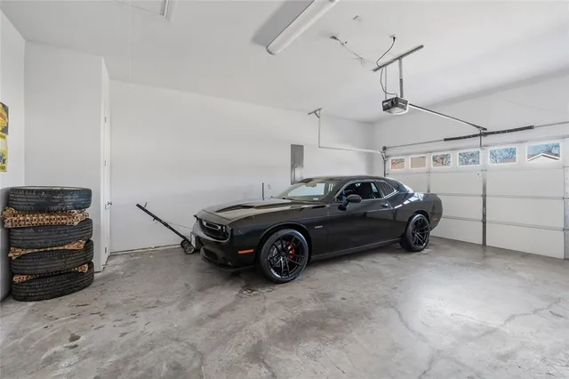 a spacious bathroom with a tub sink and mirror
