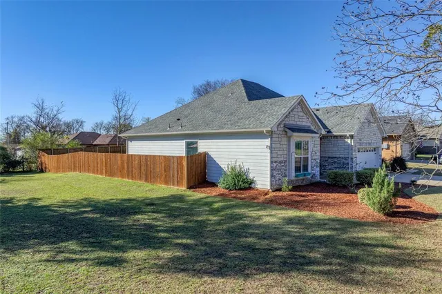 a view of room with window and wooden floor