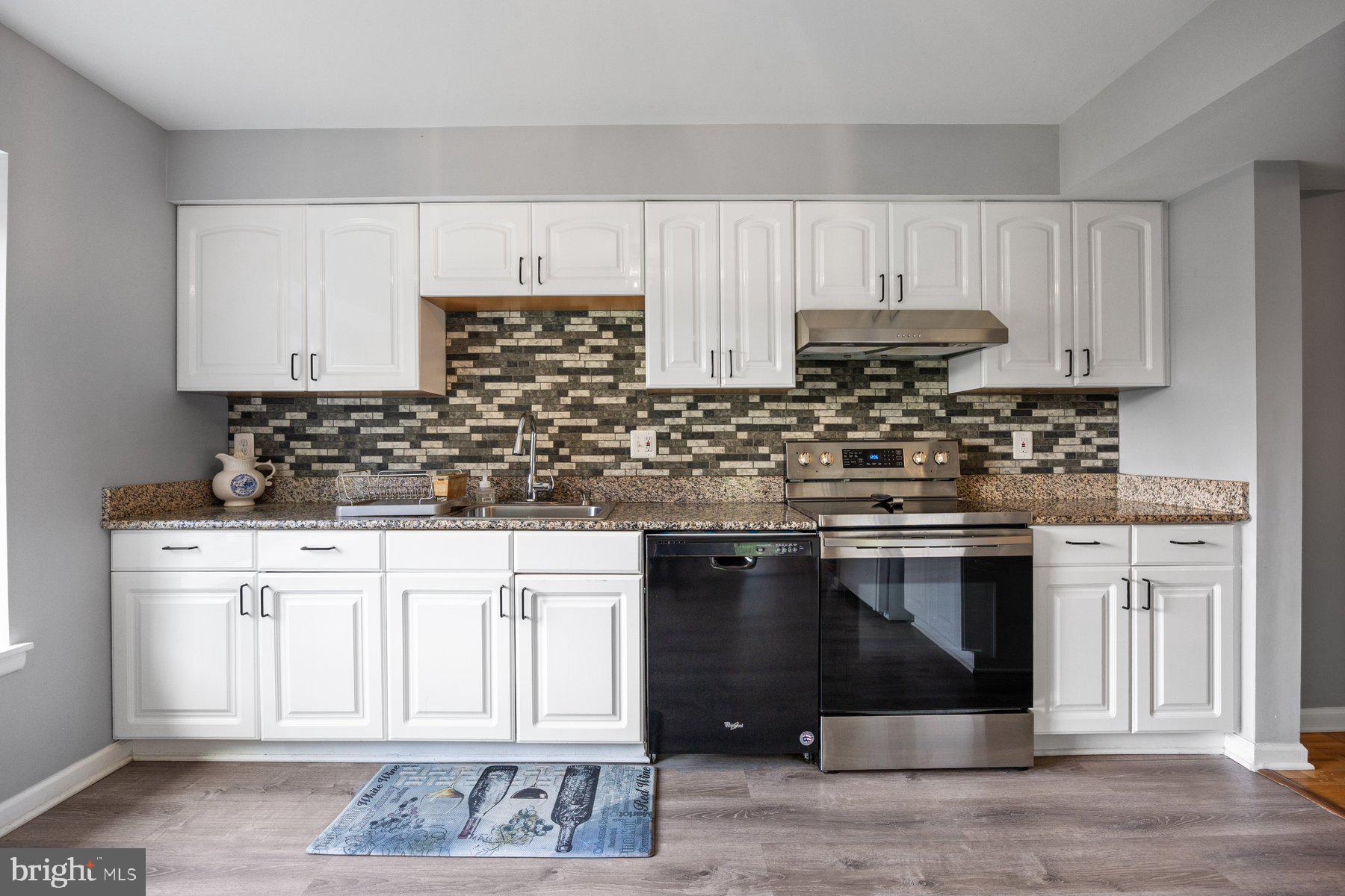 White Cabinetry & Custom Backsplash