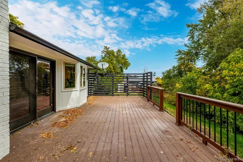 a view of a balcony with wooden floor