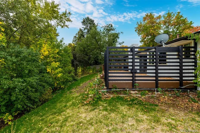 a backyard of a house with lots of green space