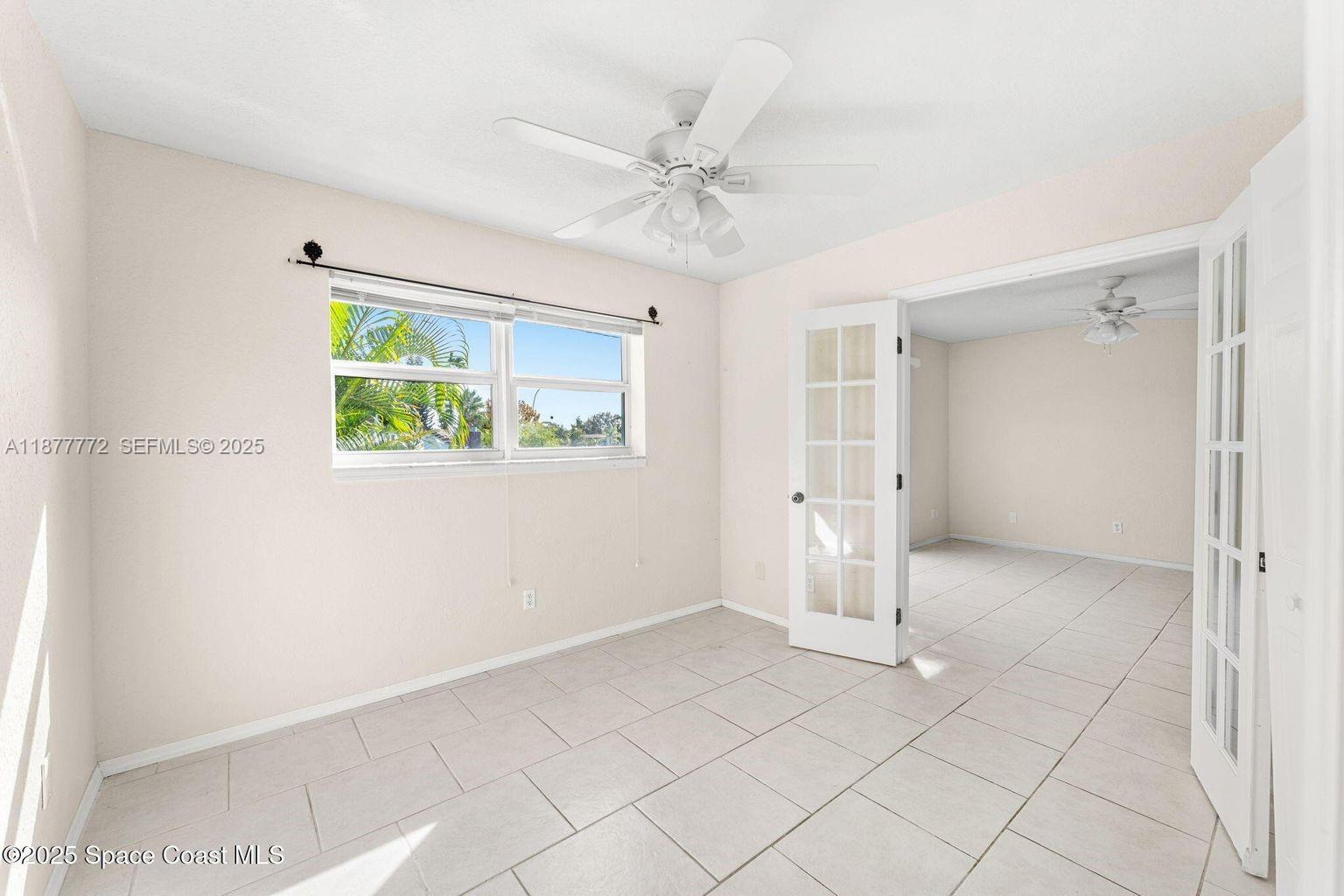 220 Columbia Drive, Unit 31 Cape Canaveral, FL 32920 - Photo 13 of 23 a view of an empty room with a window