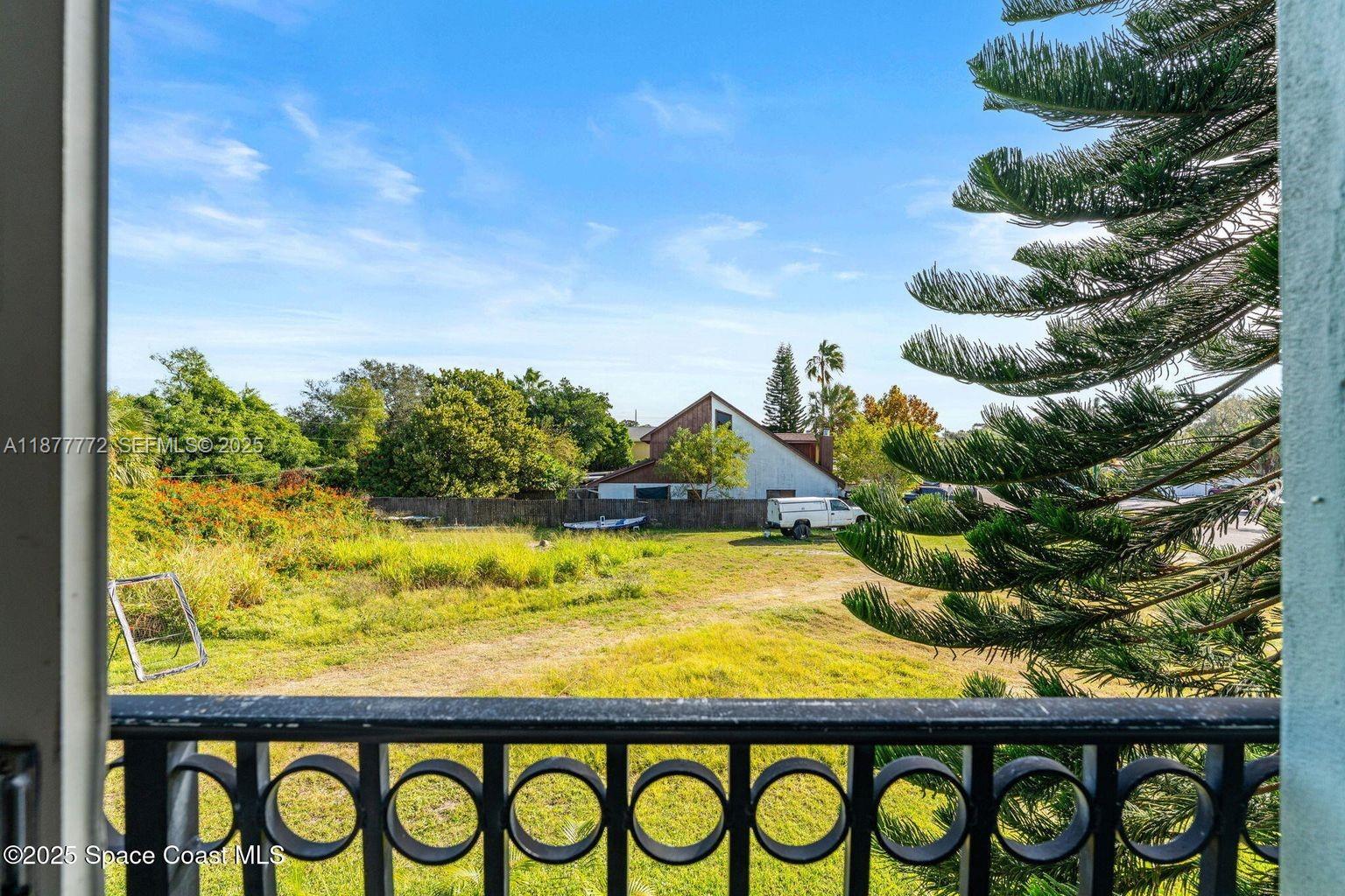 220 Columbia Drive, Unit 31 Cape Canaveral, FL 32920 - Photo 19 of 23 a view of a bunch of plants and tree