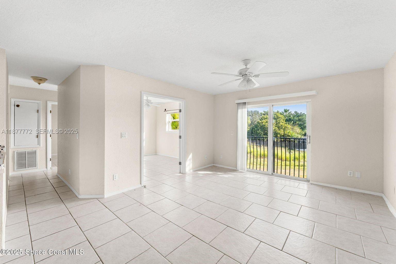 220 Columbia Drive, Unit 31 Cape Canaveral, FL 32920 - Photo 20 of 23 an empty room with windows