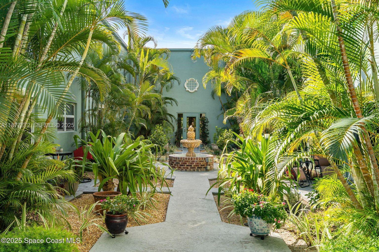 220 Columbia Drive, Unit 31 Cape Canaveral, FL 32920 - Photo 23 of 23 a view of yard with flower plants