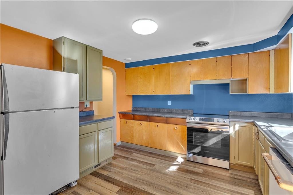 2520 Haymaker Road Monroeville, PA 15146 - Photo 18 of 33 a kitchen with stainless steel appliances granite countertop a refrigerator a sink and a stove