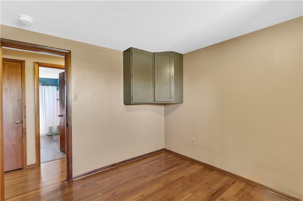 2520 Haymaker Road Monroeville, PA 15146 - Photo 25 of 33 a view of an empty room with wooden floor and a window