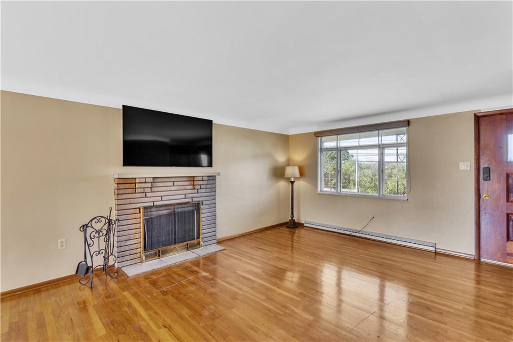 2520 Haymaker Road Monroeville, PA 15146 - Photo 6 of 33 a living room with fireplace and flat screen tv