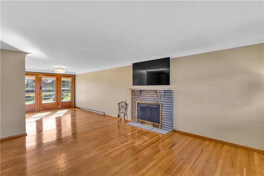 2520 Haymaker Road Monroeville, PA 15146 - Photo 8 of 33 a view of an empty room with a fireplace and a window