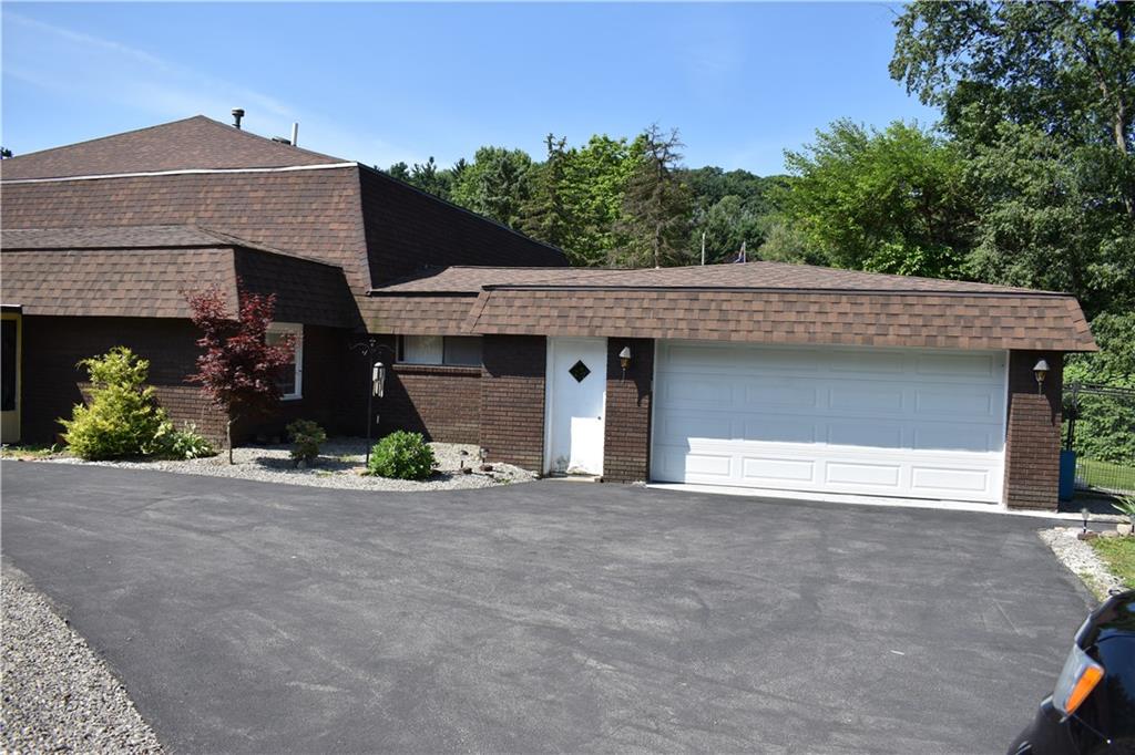 167 Miller Road Rochester, PA 15074 - Photo 2 of 25 Two car garage and wide driveway allows for extra parking.