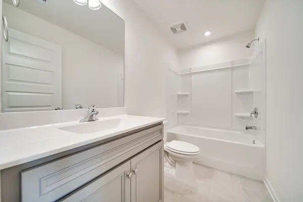 a bathroom with a sink a toilet and a bathtub