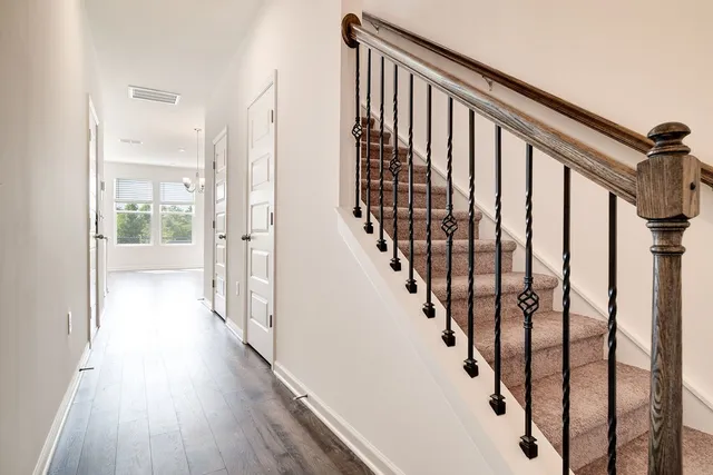 a view of staircase with wooden floor and stairs