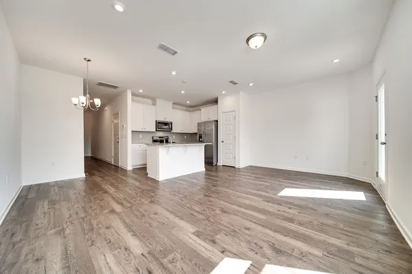 a view of kitchen view wooden floor and window