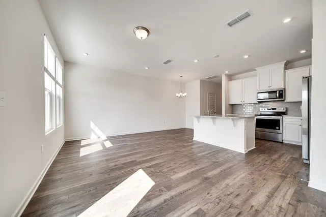 a view of kitchen with wooden floor