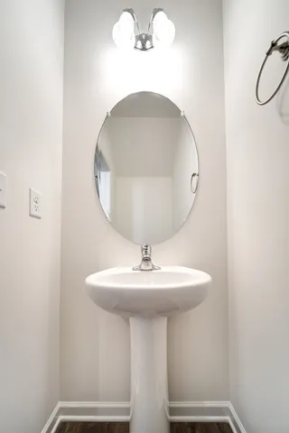 a bathroom with a sink a mirror and vanity