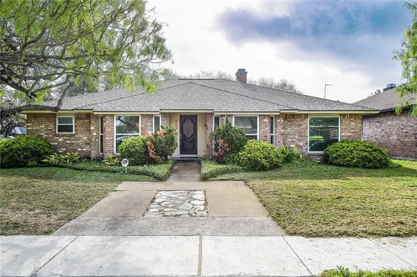 front view of a house and a yard