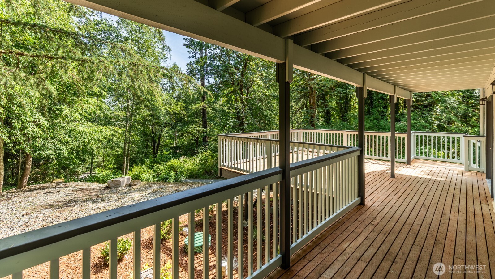7605 Northeast Hidden Cove Road Bainbridge Island, WA 98110 - Photo 18 of 36 a view of balcony with wooden floor