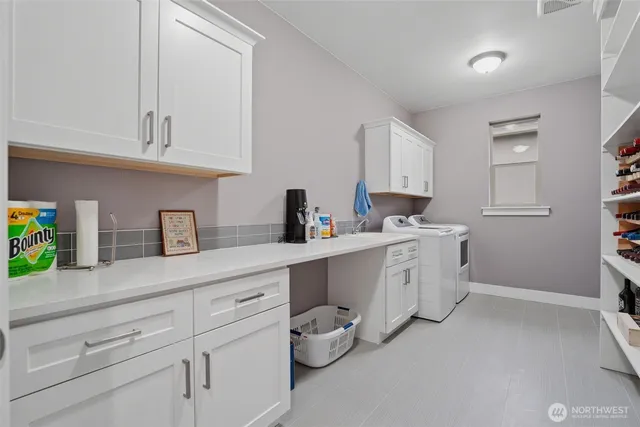 a kitchen with sink cabinets and window