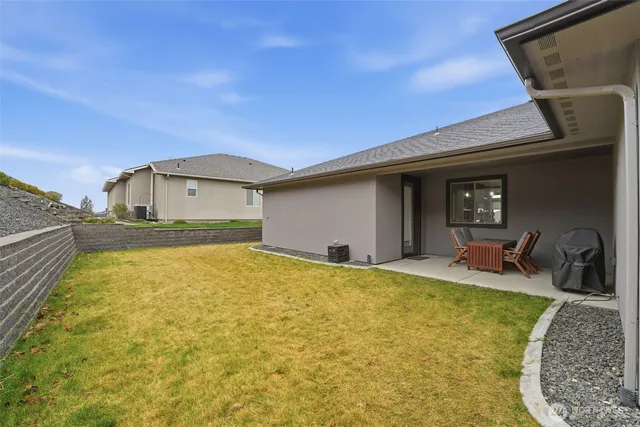 a house view with swimming pool in front of it