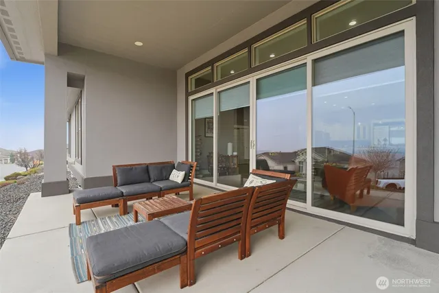 a outdoor living space with furniture and a fireplace