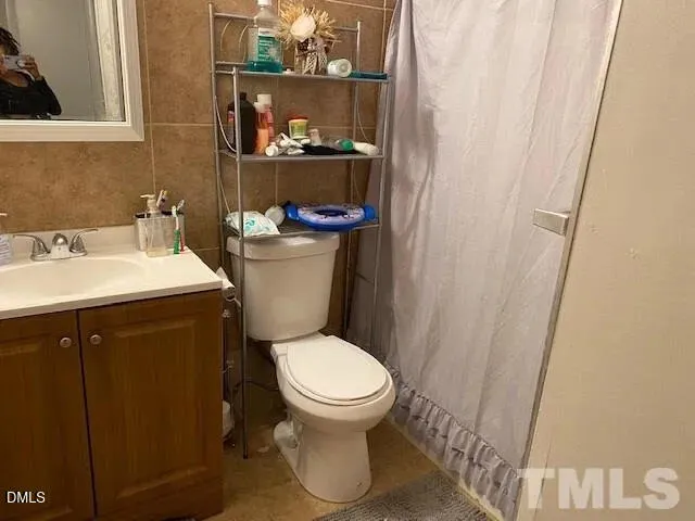 a bathroom with a toilet and a sink