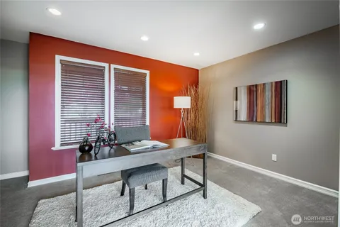 a spacious bedroom with a bed and a window