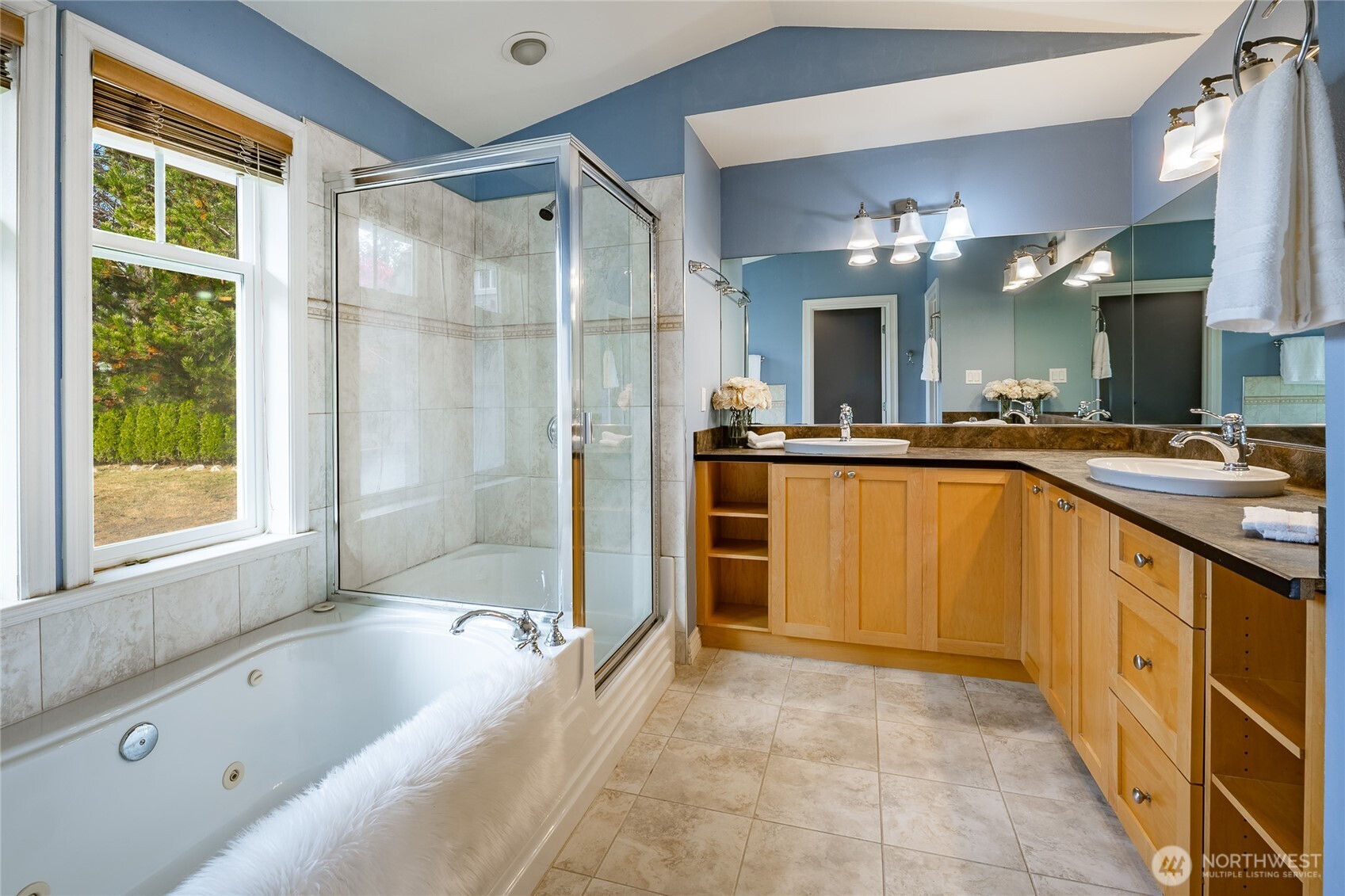 8124 Comox Road Blaine, WA 98230 - Photo 15 of 31 a spacious bathroom with a tub sink shower and mirror