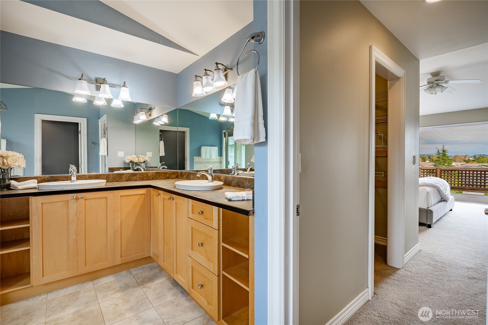 8124 Comox Road Blaine, WA 98230 - Photo 16 of 31 a bathroom with a sink a vanity and shower