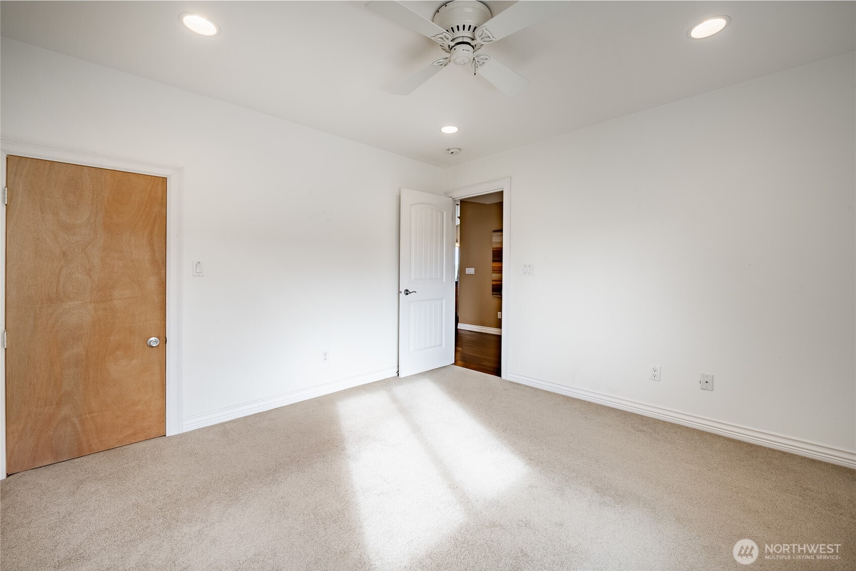 8124 Comox Road Blaine, WA 98230 - Photo 18 of 31 an empty room with a ceiling fan and closet area