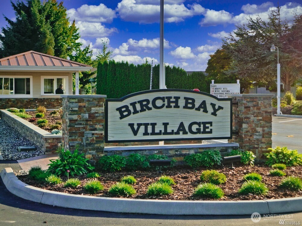 8124 Comox Road Blaine, WA 98230 - Photo 25 of 31 a sign on the side of a building