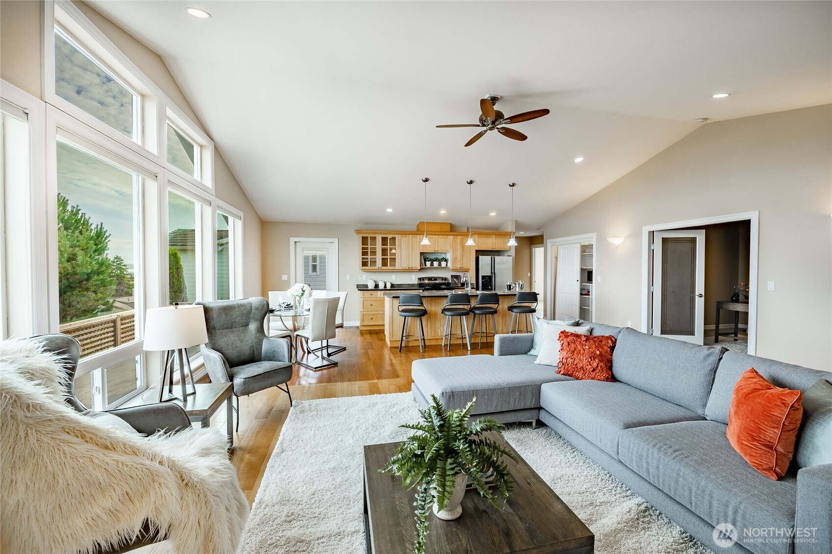 8124 Comox Road Blaine, WA 98230 - Photo 10 of 31 a living room with furniture kitchen view and a large window