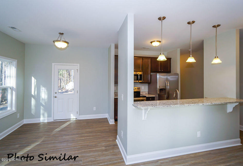 73 Owens Road Rocky Point, NC 28457 - Photo 4 of 13 Dining Area and Kitchen