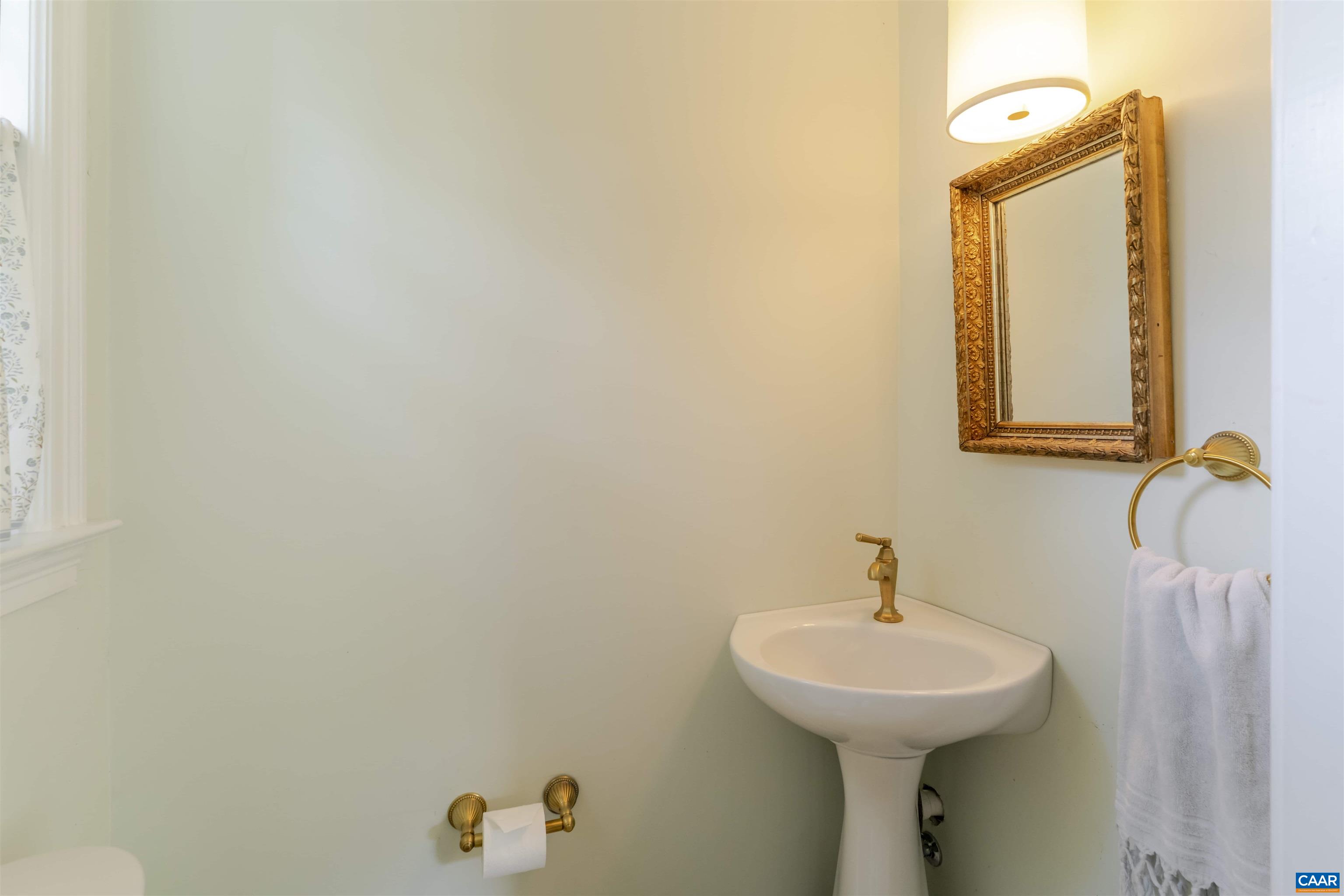 2904 Brookmere Road Charlottesville, VA 22901 - Photo 11 of 20 a bathroom with a sink a mirror and vanity