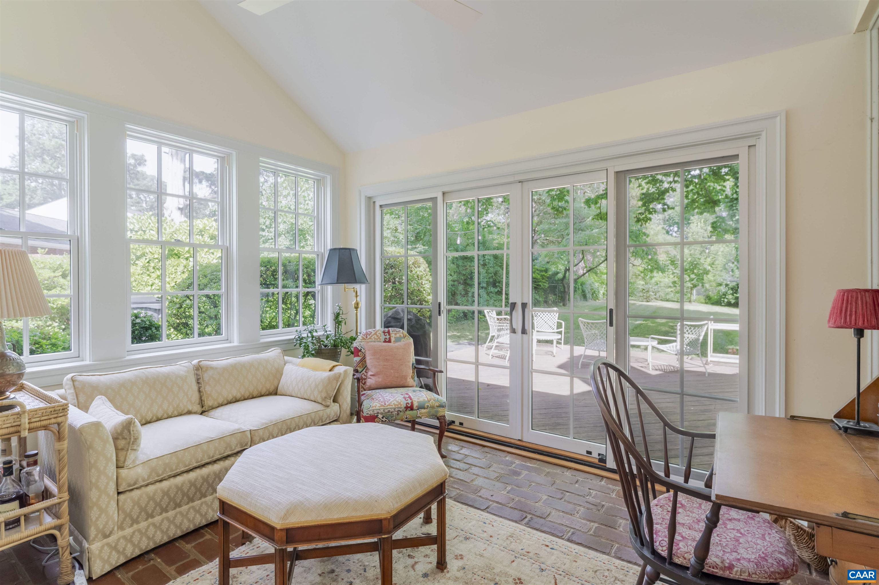 2904 Brookmere Road Charlottesville, VA 22901 - Photo 12 of 20 a living room with furniture and a floor to ceiling window