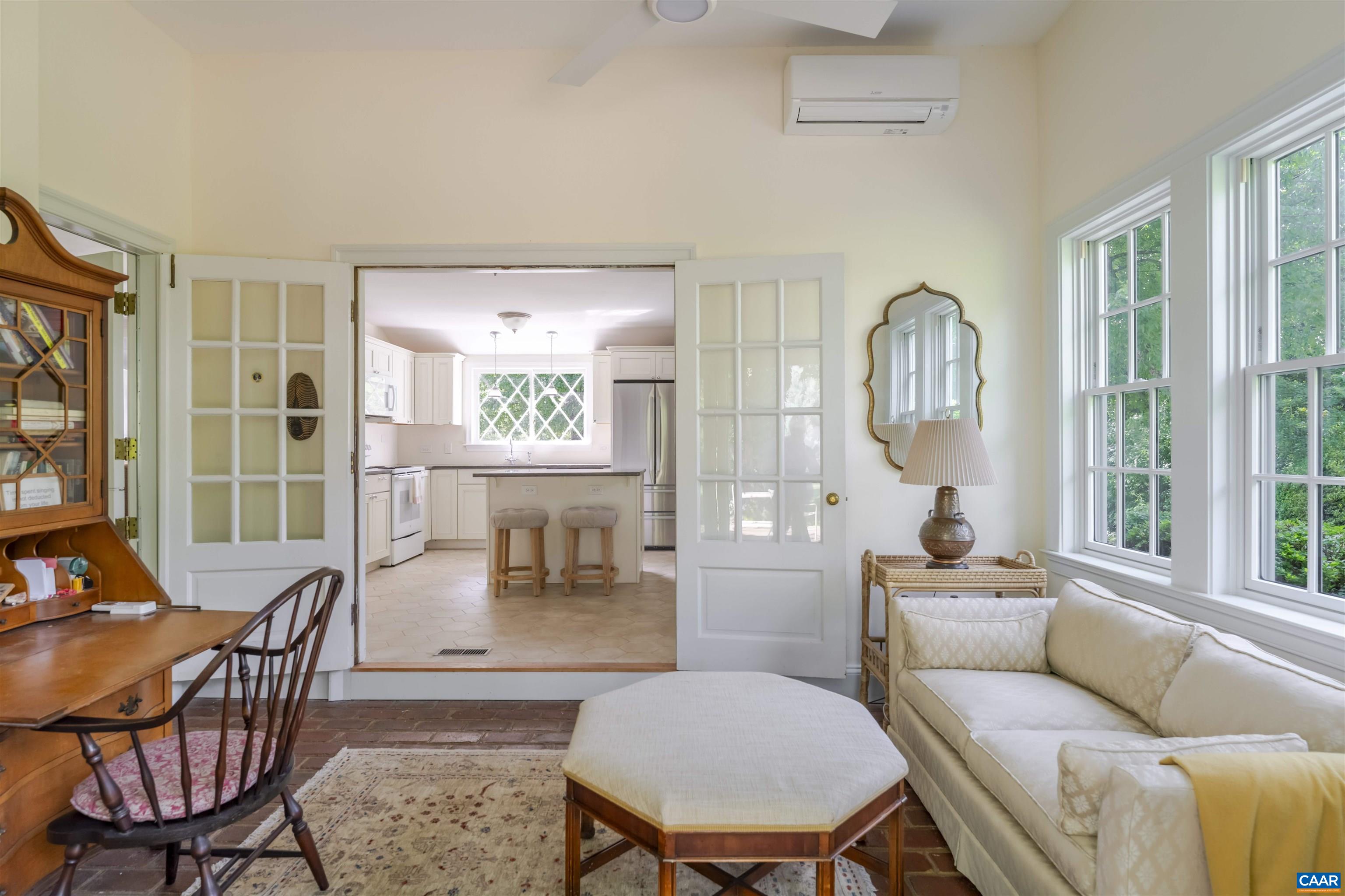2904 Brookmere Road Charlottesville, VA 22901 - Photo 13 of 20 a living room with furniture a table and a large window