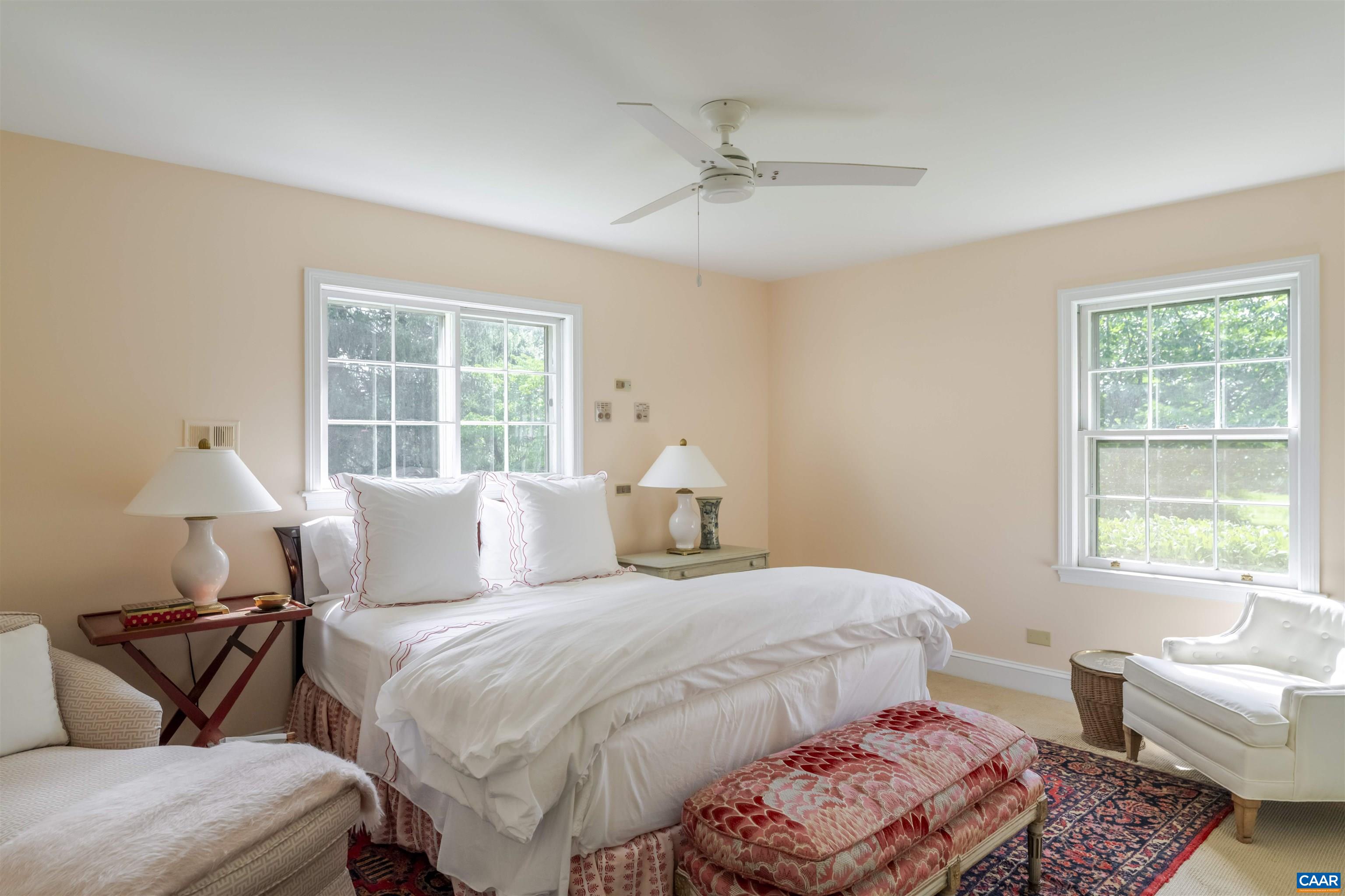 2904 Brookmere Road Charlottesville, VA 22901 - Photo 16 of 20 a bedroom with a bed and wooden floor