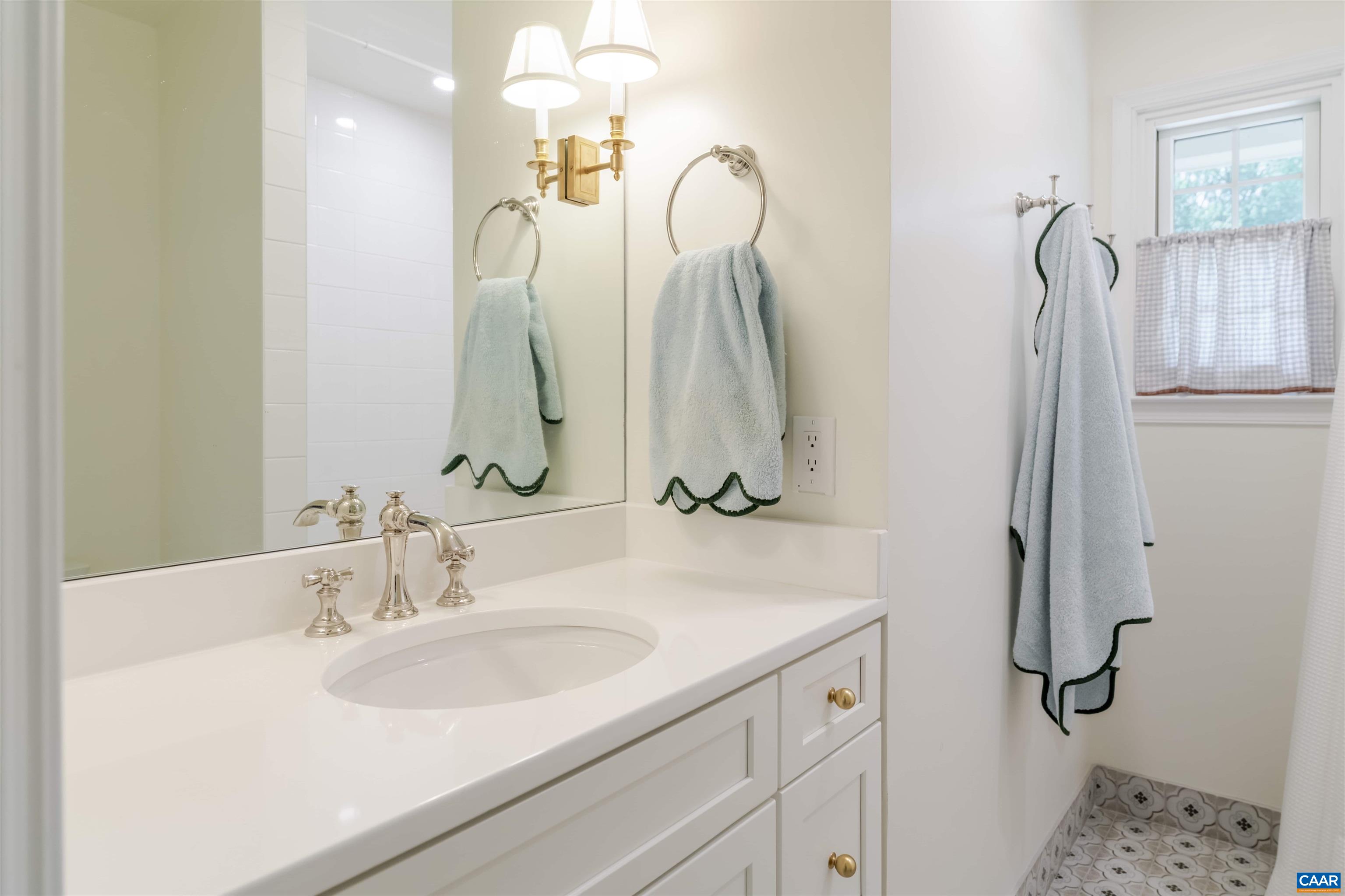 2904 Brookmere Road Charlottesville, VA 22901 - Photo 19 of 20 a bathroom with a sink vanity and a mirror