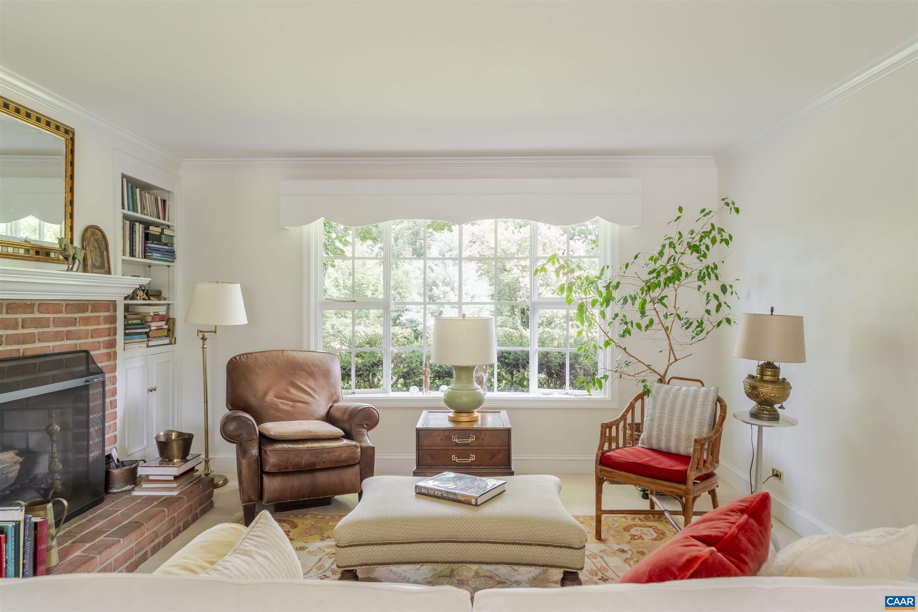 2904 Brookmere Road Charlottesville, VA 22901 - Photo 5 of 20 a living room with furniture and a fireplace