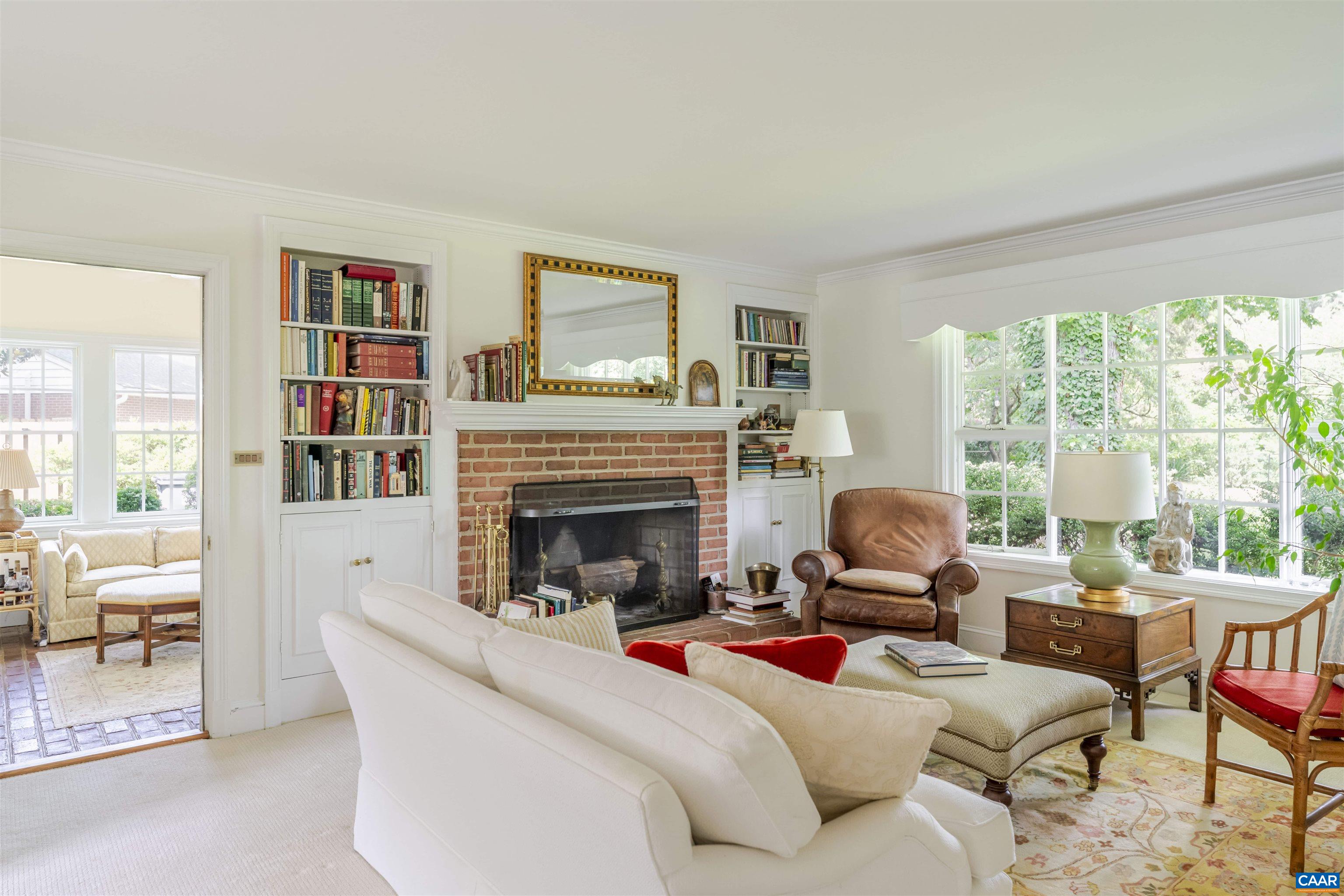 2904 Brookmere Road Charlottesville, VA 22901 - Photo 6 of 20 a living room with furniture large window and a fireplace