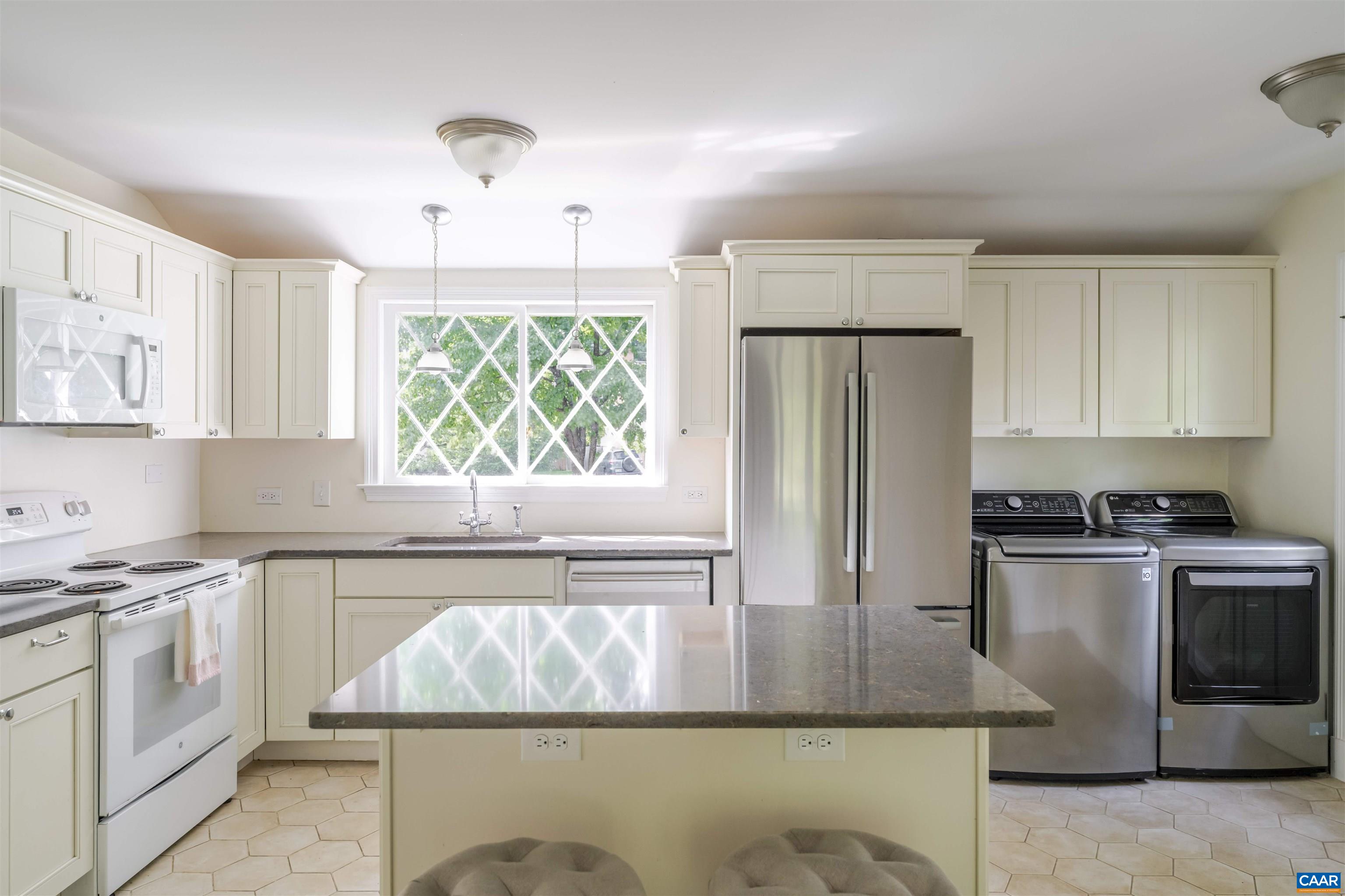2904 Brookmere Road Charlottesville, VA 22901 - Photo 9 of 20 a kitchen with stainless steel appliances granite countertop a stove a sink and a refrigerator