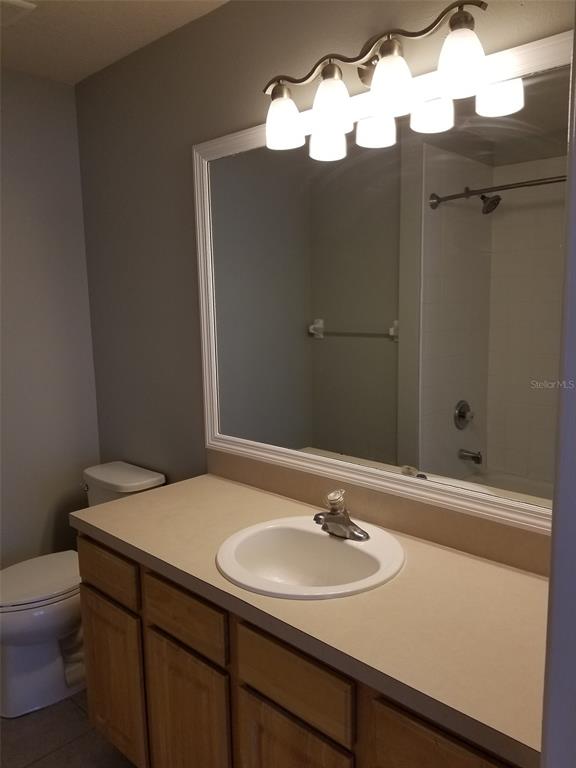 4536 Kennewick Place Riverview, FL 33578 - Photo 27 of 50 a bathroom with a sink vanity and toilet