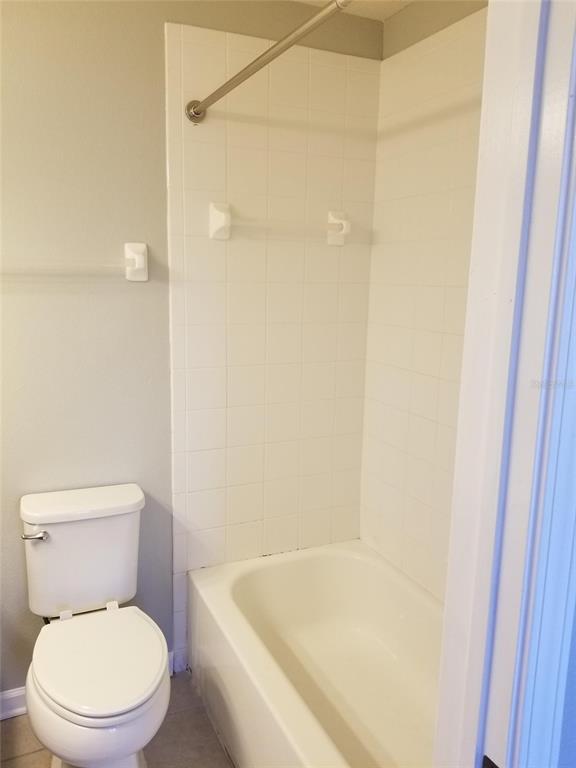 4536 Kennewick Place Riverview, FL 33578 - Photo 38 of 50 a white toilet sitting next to a bath tub