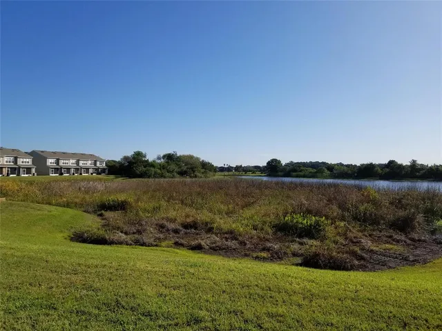 a view of a lake with a big yard