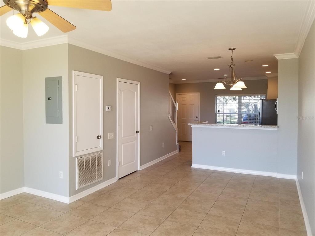 4536 Kennewick Place Riverview, FL 33578 - Photo 5 of 50 a view of a room with a chandelier fan and kitchen view