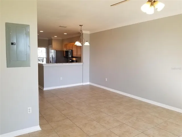 a view of a kitchen with a sink and a refrigerator