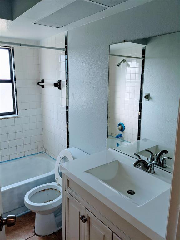 5327 Baldock Avenue Spring Hill, FL 34608 - Photo 16 of 18 a bathroom with a sink a toilet and shower