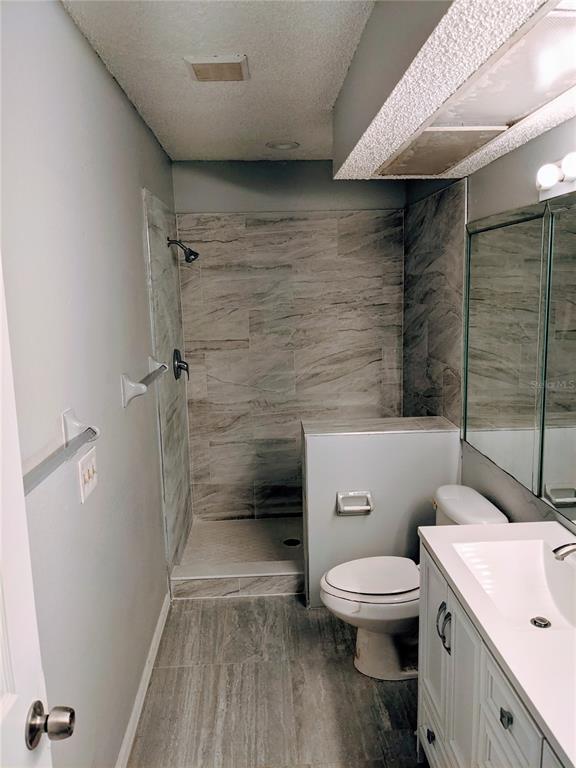 5327 Baldock Avenue Spring Hill, FL 34608 - Photo 5 of 18 a bathroom with a toilet and a shower