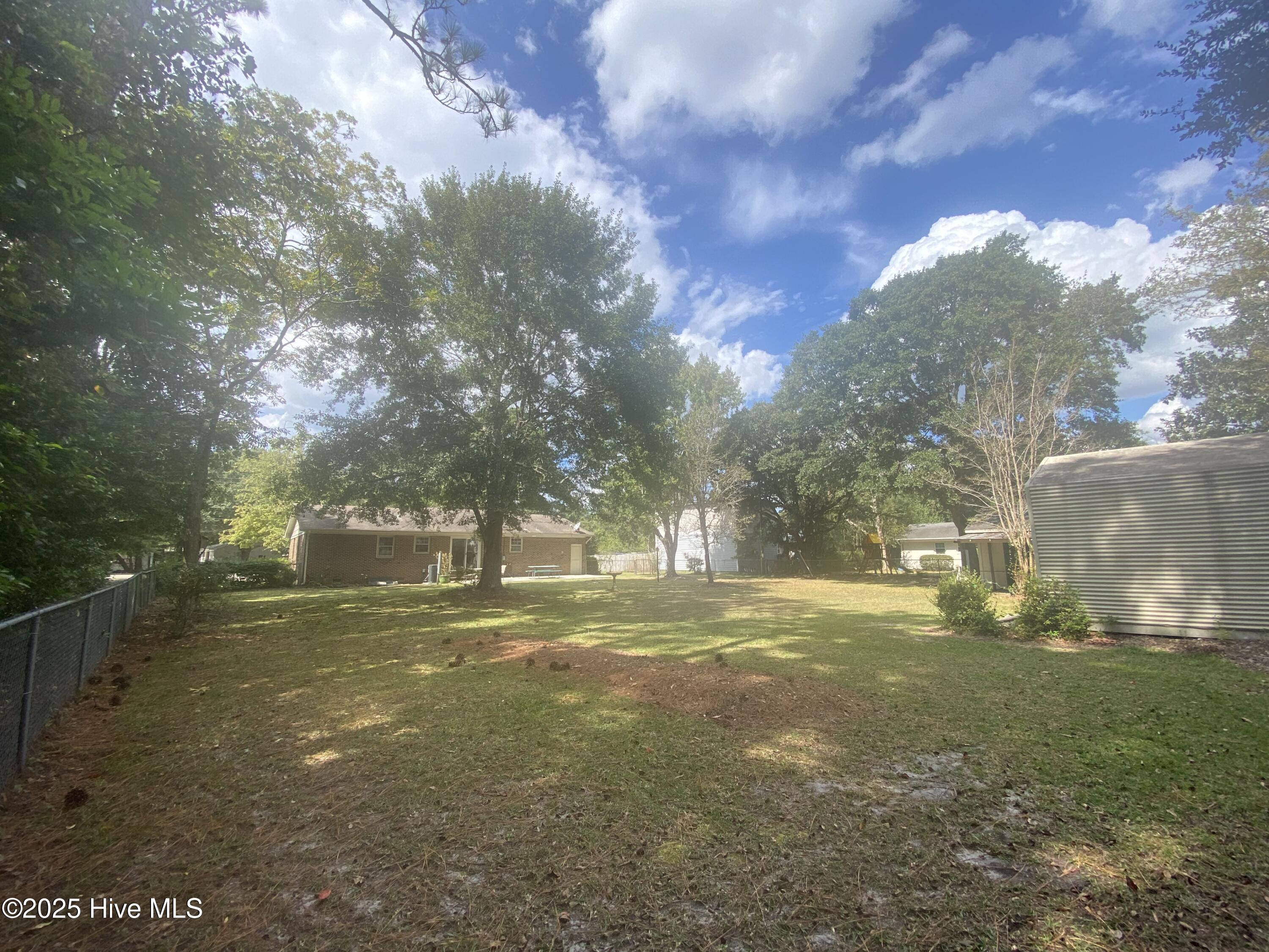 4641 Masonboro Loop Road Wilmington, NC 28409 - Photo 8 of 42 Large backyard in bloom!