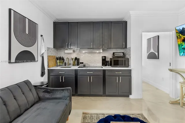 a kitchen with cabinets and window